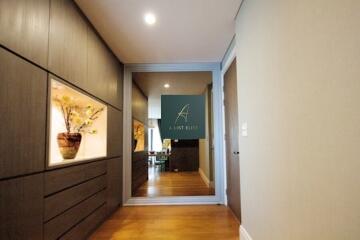 Hallway view with decorative elements and large mirror