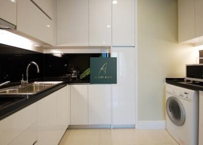 Modern kitchen with white cabinets and appliances