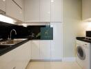 Modern kitchen with white cabinets and appliances