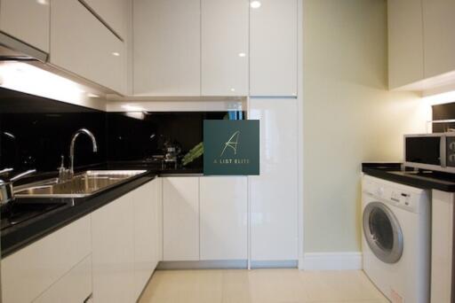 Modern kitchen with white cabinets and appliances