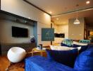 Modern living room with blue sofa and entertainment center