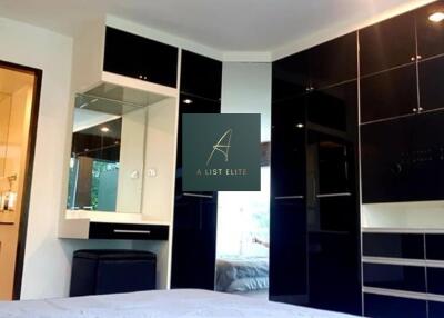 Modern bedroom with black built-in wardrobes