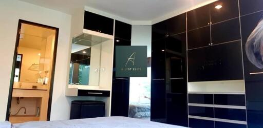 Modern bedroom with black built-in wardrobes