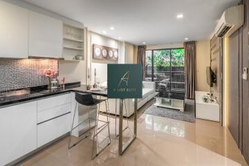 Spacious modern living area with kitchen and natural light