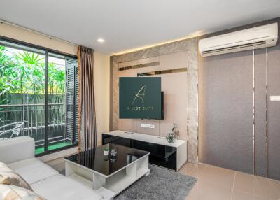 Modern living room with large window and balcony