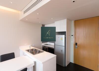 Modern kitchen with wooden door