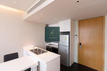 Modern kitchen with wooden door