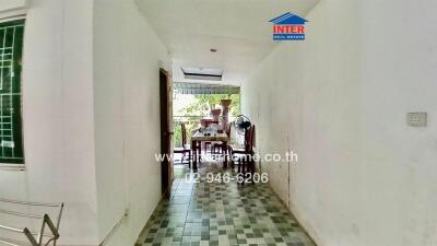 Bright hallway leading to an outdoor dining area