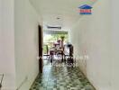 Bright hallway leading to an outdoor dining area