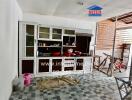 Kitchen with cabinets and open access to an outdoor area