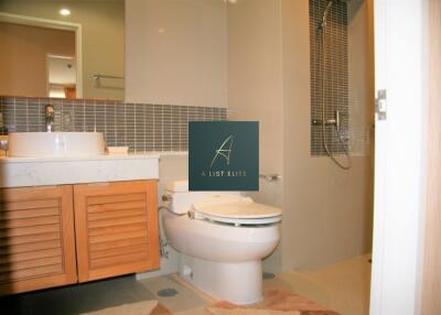 Modern bathroom with vanity, toilet, and shower