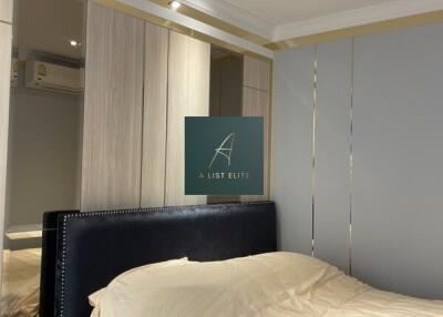 Modern bedroom with fitted wardrobe and upholstered headboard