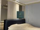 Modern bedroom with fitted wardrobe and upholstered headboard