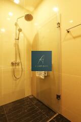 Modern bathroom with glass shower enclosure and rainfall showerhead