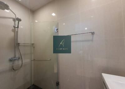 Modern bathroom with shower and towel rack