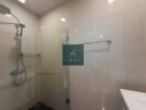 Modern bathroom with shower and towel rack