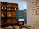 Dining area with table set for four, decorative shelving, and pendant lighting