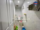 A small bathroom with various toiletries and cleaning supplies