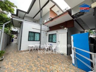 Spacious outdoor area with tiled flooring and seating