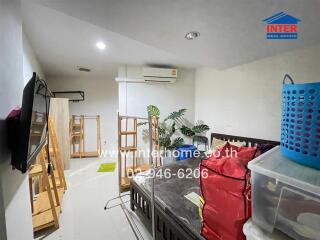 Bedroom with various items and air conditioner