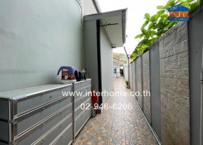 Paved outdoor walkway with storage cabinets