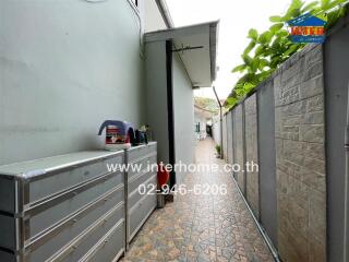 Paved outdoor walkway with storage cabinets