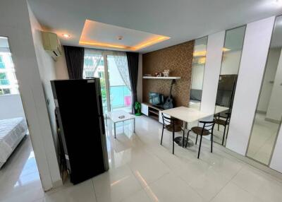 Modern living room with dining area and large windows