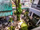 Aerial view of a courtyard with plants and outdoor seating