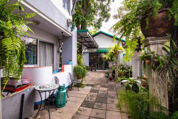 Green and lush garden with patio seating