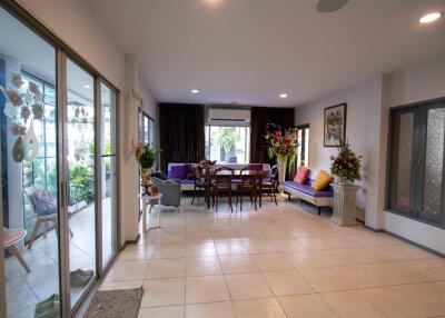 Spacious living room with dining area and large glass sliding doors