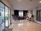 Spacious living room with dining area and large glass sliding doors