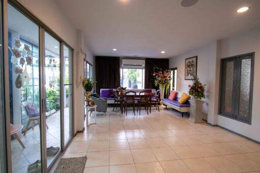 Spacious living room with dining area and large glass sliding doors