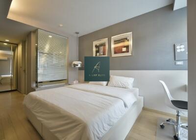 Modern bedroom with double bed and study area