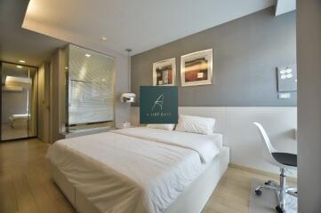 Modern bedroom with double bed and study area