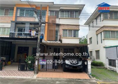 Two-story townhouse with carport and balcony