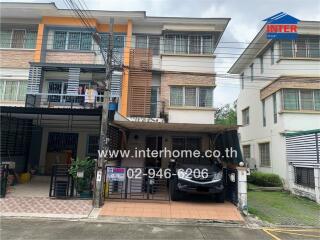 Two-story townhouse with carport and balcony