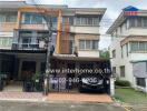 Two-story townhouse with carport and balcony