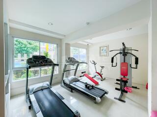 Residential gym with various exercise equipment