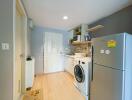 Compact kitchen with refrigerator and washing machine