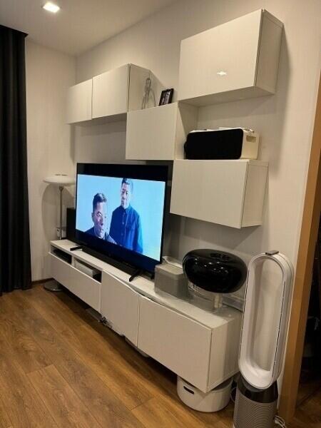 Modern living room with entertainment system and wall-mounted cabinets