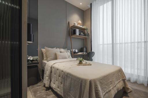 Modern bedroom with a cozy bed, decor items, and large windows with sheer curtains