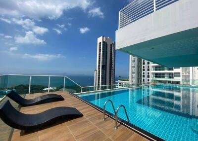 Luxury building with rooftop pool and ocean view