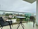 Balcony with outdoor seating and city view