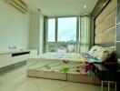 Modern bedroom with large window and city view