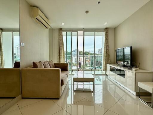 Modern living room with large windows and city view