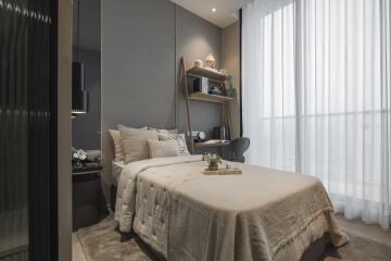 Modern cozy bedroom with neutral tones and natural light