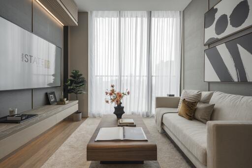 Modern living room with large window, sofa, and coffee table