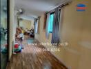 Hallway with wooden floors and windows