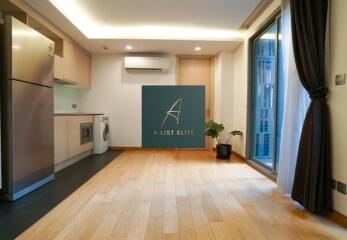 Modern kitchen with wooden flooring and appliances