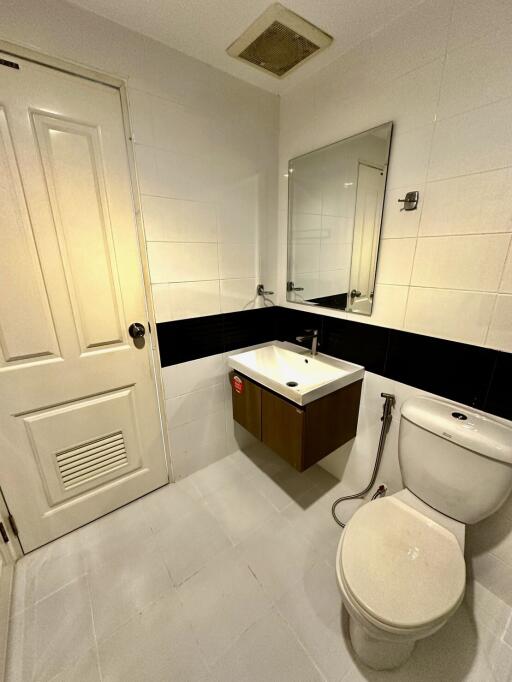 Modern bathroom with white tiles and fixtures